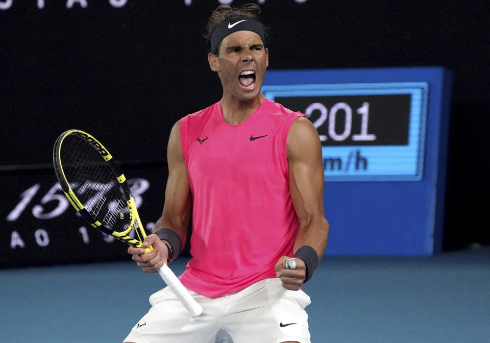 Spain's Rafael Nadal celebrates after winning the third set against Australia's Nick Kyrgios during their fourth round singles match at the Australian Open tennis championship in Melbourne, Australia, Monday, Jan. 27, 2020. (AP Photo/Lee Jin-man)