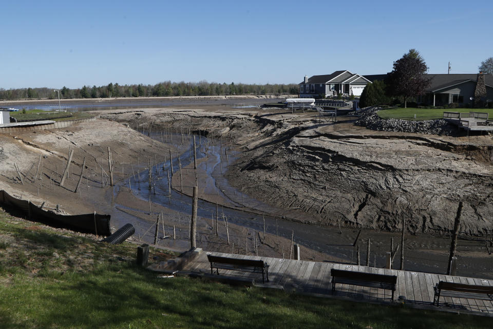 View of Wixom Lake, Thursday, May 21, 2020, after the water was drained after the Edenville Dam failed and flood waters rushed south, ravaging the landscape in its path, in Edenville Township, Mich. (AP Photo/Carlos Osorio)