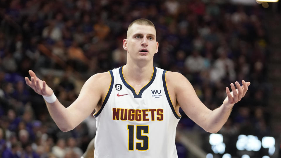 Denver Nuggets center Nikola Jokic (15) reacts after looking for a foul during the first half of an NBA basketball game against the Utah Jazz Wednesday, Oct. 19, 2022, in Salt Lake City. (AP Photo/Rick Bowmer)