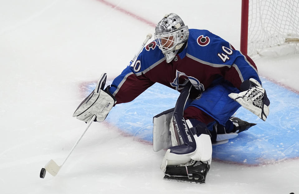 Colorado Avalanche goaltender Alexandar Georgiev makes a stick save against the Los Angeles Kings during the first period of an NHL hockey game Friday, Jan. 26, 2024, in Denver. (AP Photo/David Zalubowski)