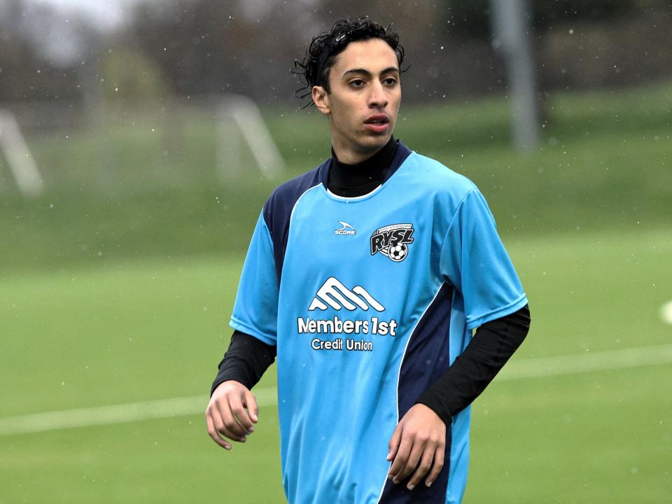 Exchange student Ali Aljamal plays for his Redding FC soccer team in the rain on Friday, March 22, 2024.
