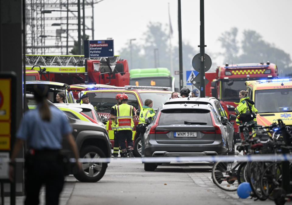 Police officers cordon off the area of a shooting outside the Emporia shopping center in Malmo, Sweden, Friday, Aug. 19, 2022. (Johan Nilsson/TT News Agency via AP)