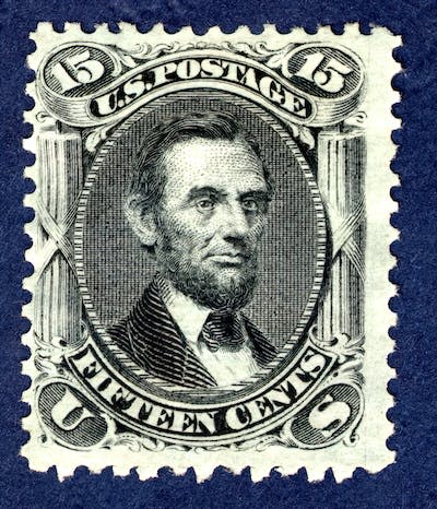 The 15-cent Abraham Lincoln stamp was first issued in 1866, one year after his assassination. <a href="https://www.gettyimages.com/detail/news-photo/15c-abraham-lincoln-e-grill-single-1867-unused-perf-12-news-photo/1338659993?adppopup=true" rel="nofollow noopener" target="_blank" data-ylk="slk:Heritage Images/Hulton Archive via Getty Images;elm:context_link;itc:0;sec:content-canvas" class="link ">Heritage Images/Hulton Archive via Getty Images</a>
