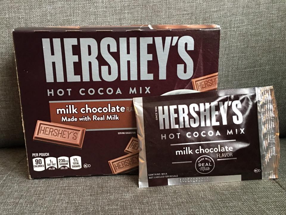 brown box of Hershey's hot cocoa with pack taken out