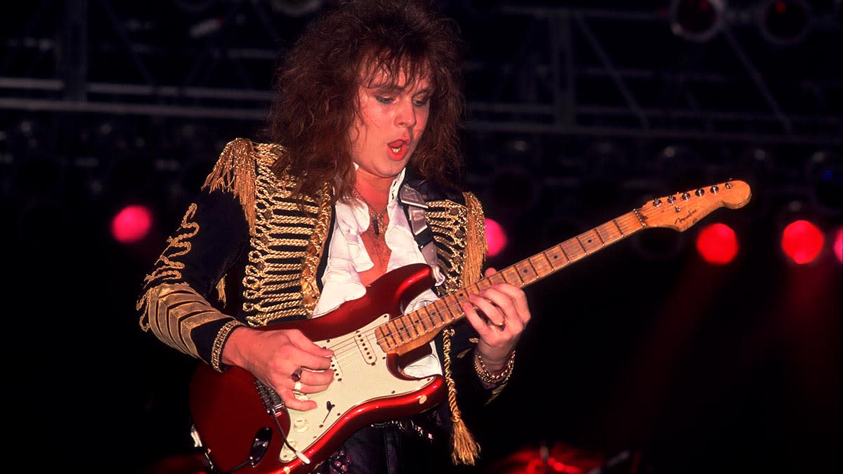  Yngwie Malmsteen live onstage in 1985, shredding a red Stratocaster. 