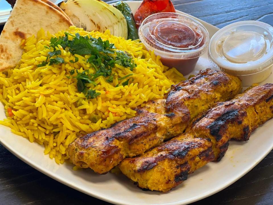 US Fried Chicken’s chicken kebab with yellow rice comes with pita, garlic white sauce and a Mediterranean-style tomato sauce. US Fried Chicken