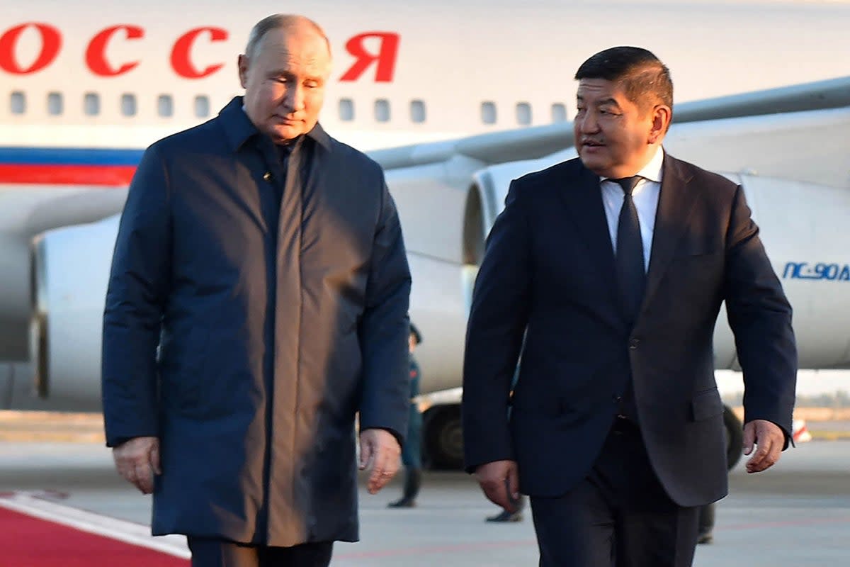 Chair of the Cabinet of Ministers of Kyrgyzstan Akylbek Zhaparov walking with Russia's President Vladimir Putin upon his arrival at the Manas International Airport in Bishkek (CABINET OF MINISTERS OF KYRGYZST)