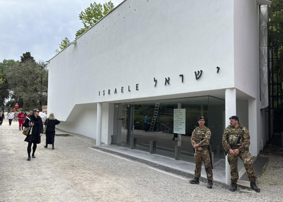 Italian soldiers patrol the Israeli national pavilion at the Biennale contemporary art fair in Venice, Italy, Tuesday, April 16, 2024. The artist and curators representing Israel at this year's Venice Biennale have announced Tuesday they won't open the Israeli pavilion until there is a cease-fire in Gaza and an agreement to release hostages taken Oct. 7. (AP Photo/Colleen Barry)