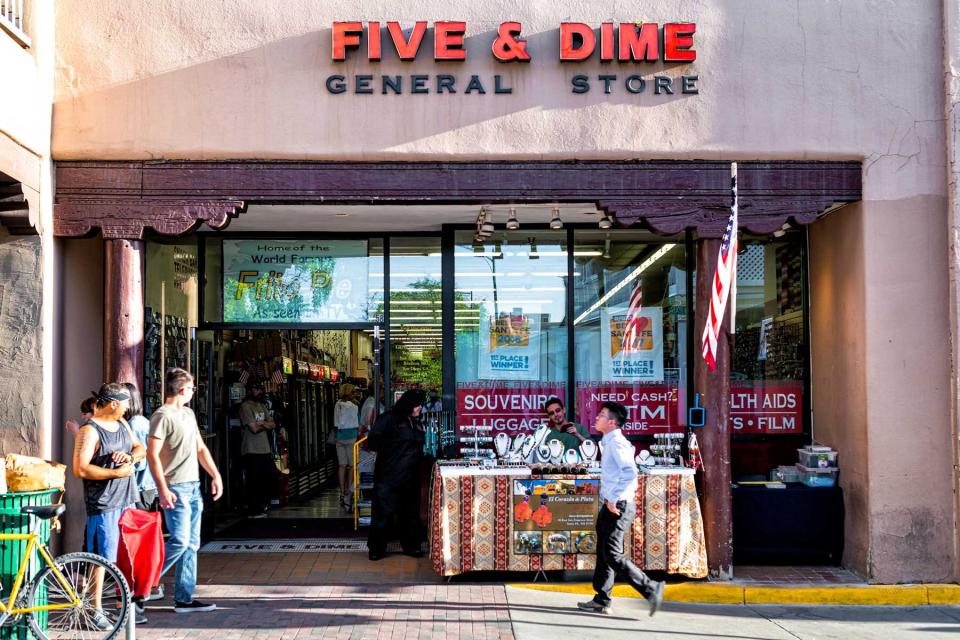 Shop store sign for five and dime on old town street in United States New Mexico city with adobe style architecture
