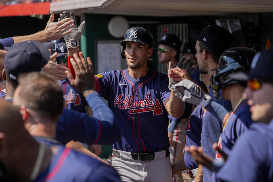 Atlanta Braves' Matt Olson, center, celebrates with teammates in the dugout after hitting a solo home run during the second inning of a baseball game against the Cincinnati Reds, Thursday, Sept. 19, 2024, in Cincinnati. (AP Photo/Joshua A. Bickel)