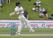 New Zealand's Henry Nicholls hits the ball to the boundary during play on day three of the first cricket test between New Zealand and Sri Lanka in Wellington, New Zealand, Monday, Dec. 17, 2018. (AP Photo/Mark Baker )