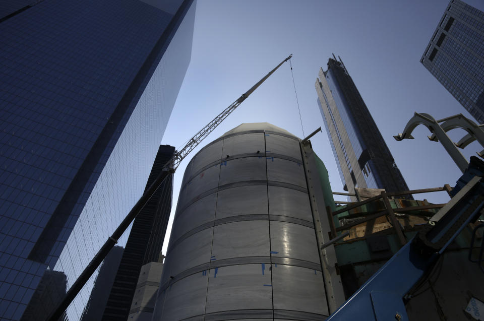 A crane lifts sections of marble onto the dome of St. Nicholas Greek Orthodox Church and National Shrine on Friday, Aug. 27, 2021, in New York. The shrine will have a ceremonial lighting on the eve of the 20th anniversary of the Sept. 11, 2001 attacks, while the interior is slated for completion next year. (AP Photo/Jessie Wardarski)