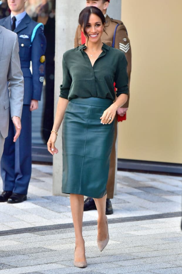 <p>This ensemble goes down in history as one of our favorite Duchess of Sussex looks ever! Meghan was on to something when she paired this teal leather pencil skirt by Hugo Boss with a teal shirt. She also owns this skirt in maroon.</p>