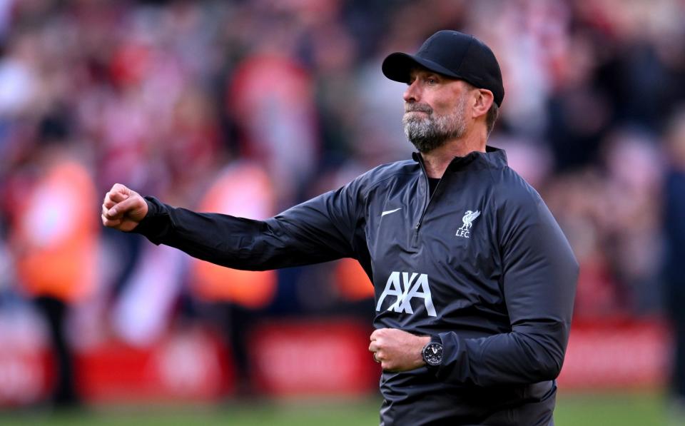 Jurgen Klopp manager of Liverpool celebrating with the fans at the end of the Premier League match between Liverpool FC and Tottenham Hotspur