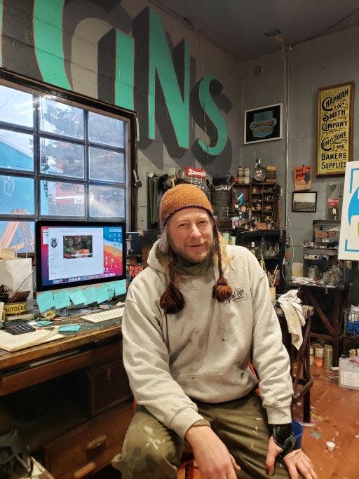 Artist Shawn Gilheeney in his Providence Painted Signs workshop.