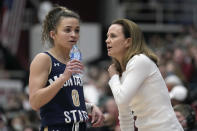 Montana State head coach Tricia Binford talks with guard Darian White (0) during the first half of a first-round game against Stanford in the NCAA women's college basketball tournament Friday, March 18, 2022, in Stanford, Calif. (AP Photo/Tony Avelar)