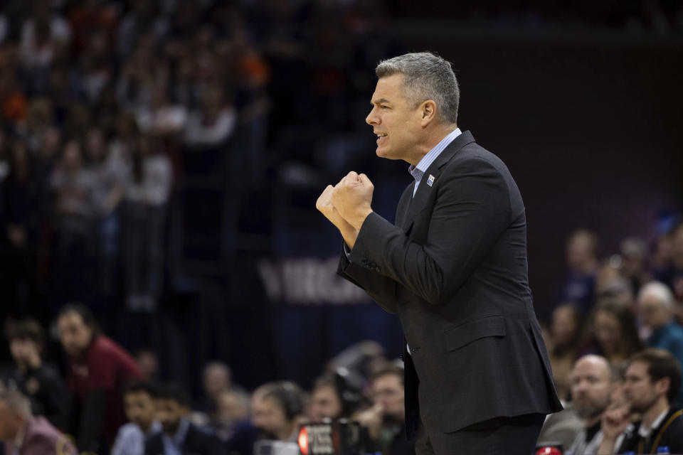 Virginia head coach Tony Bennett yells to his team during the first half of an NCAA college basketball game against Boston College in Charlottesville, Va., Saturday, Jan. 28, 2023. (AP Photo/Mike Kropf)