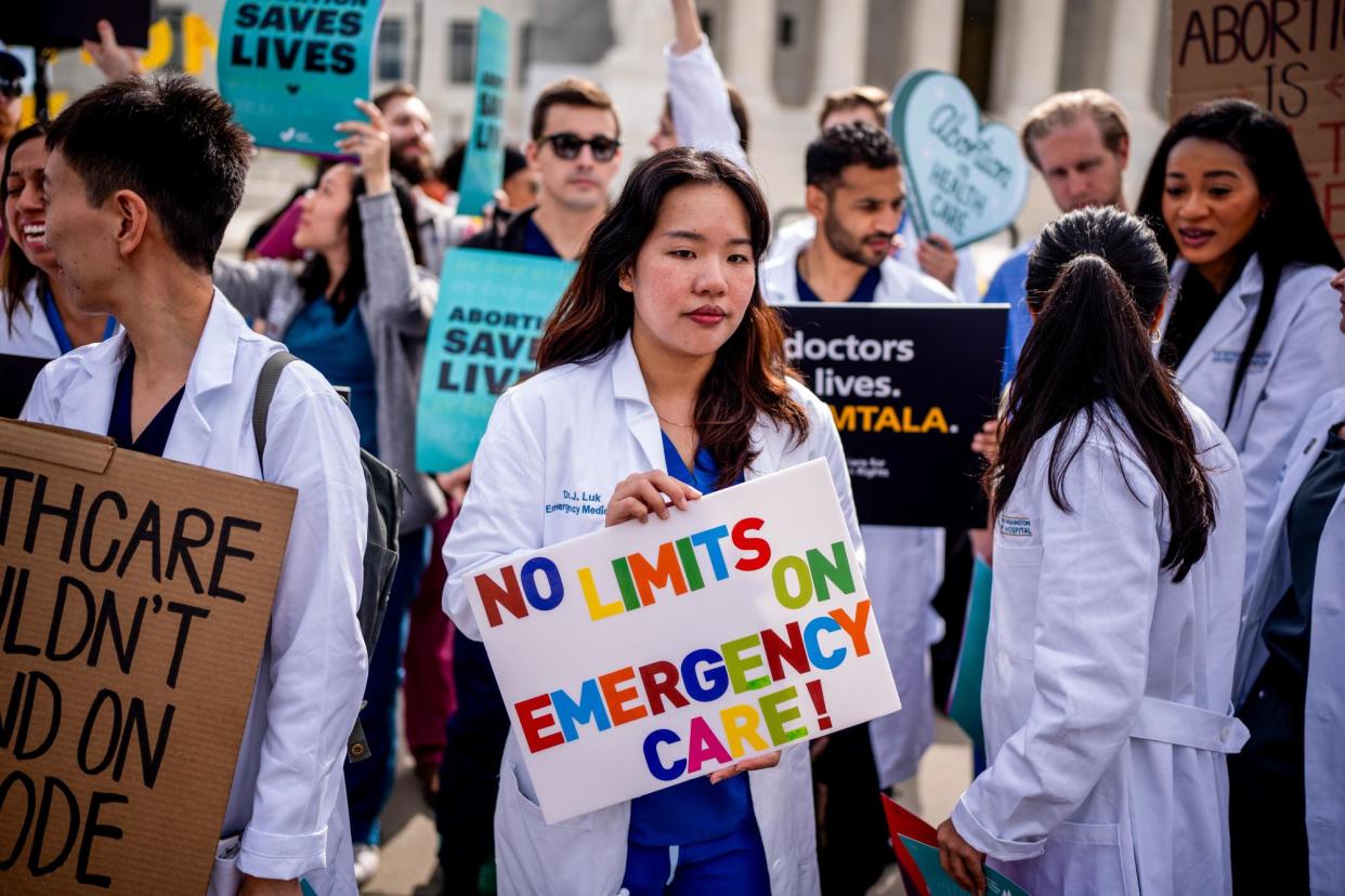 <span>A group of doctors join abortion rights supporters at a rally outside the supreme court in Washington DC on 24 April 2024.</span><span>Photograph: Andrew Harnik/Getty Images</span>