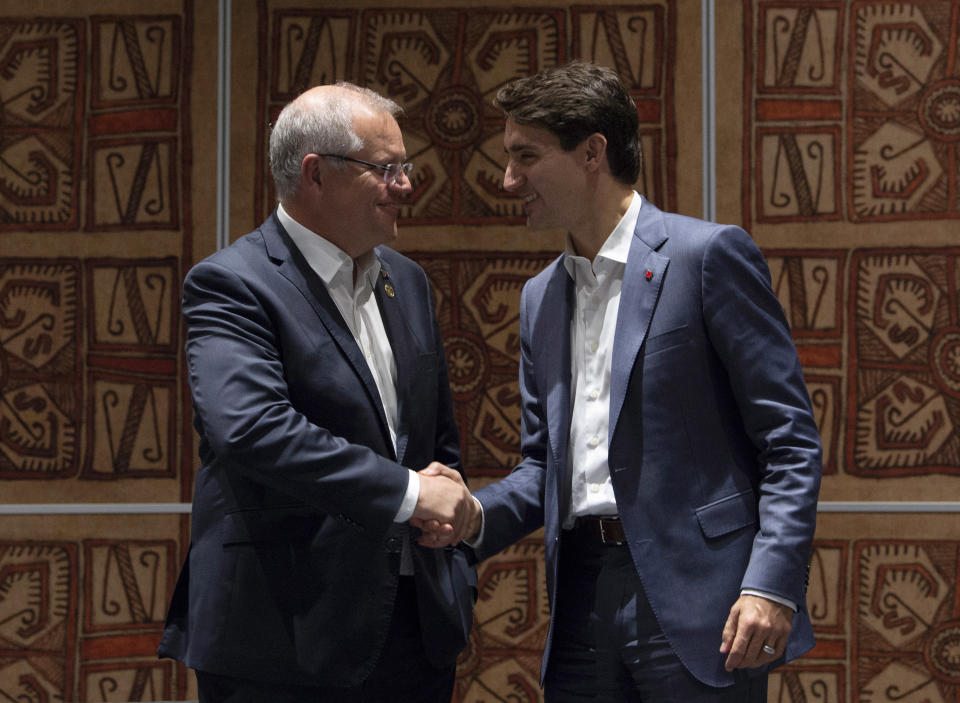 Canadian Prime Minister Justin Trudeau, right, speaks with Australian Prime Minister Scott Morrison during a bilateral meeting at the Asia-Pacific Economic Cooperation Summit in Port Moresby, Papua New Guinea, Sunday, Nov. 18, 2018. (Adrian Wyld/The Canadian Press via AP)