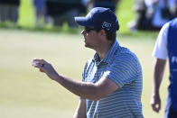 Adam Schenk holds up the ball after finishing his round on the18th hole of the North Course during the second round of the Farmers Insurance Open golf tournament, Thursday Jan. 27, 2022, in San Diego. (AP Photo/Denis Poroy)