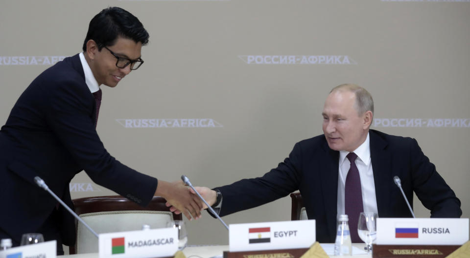 Russian President Vladimir Putin, right, shakes hands with Madagascar's President Andry Rajoelina, after a luncheon with the heads of African regional organizations on the sideline of Russia-Africa summit in the Black Sea resort of Sochi, Russia, Wednesday, Oct. 23, 2019. (AP Photo/Sergei Chirikov, pool photo via AP)