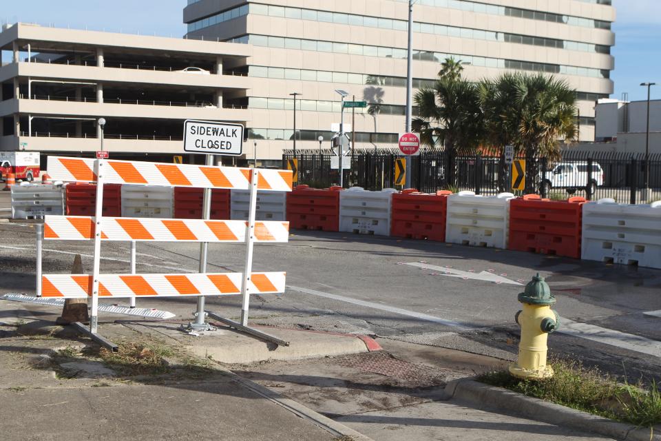 The Texas Department of Transportation has added water-filled barrels as traffic controls at the Twigg Street exit.