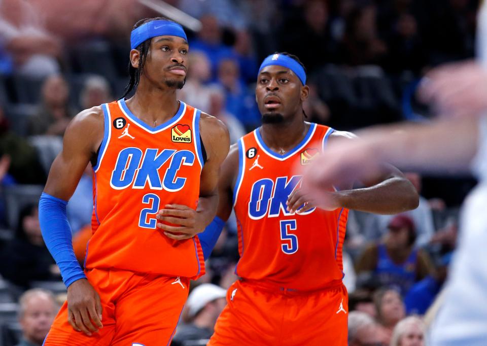 Thunder guard Shai Gilgeous-Alexander (2) reacts after a basket next to Luguentz Dort (5) during a game against the Pacers on Jan. 18 at Paycom Center.