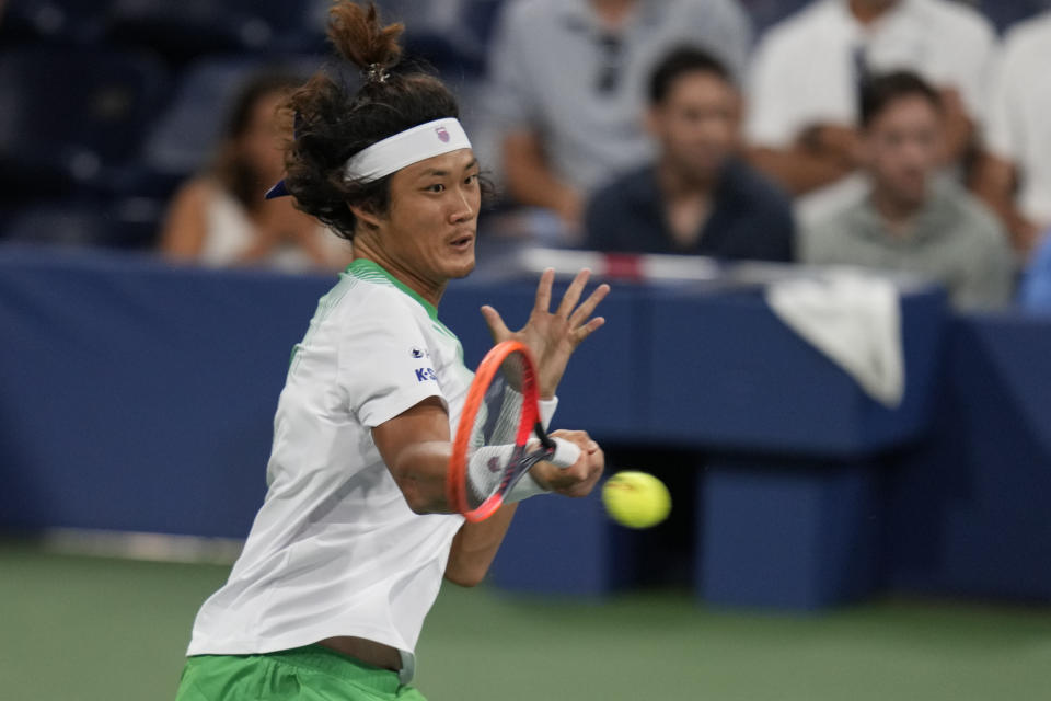 CORRECTS SPELLING TO ZHANG, INSTEAD OF ZANG - Zhang Zhizhen, of China, returns a shot to Casper Ruud, of Norway, during the second round of the U.S. Open tennis championships, Wednesday, Aug. 30, 2023, in New York. (AP Photo/Charles Krupa)