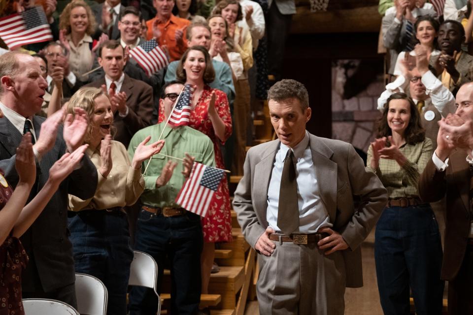 J. Robert Oppenheimer (Cillian Murphy) gets an ovation after the atomic bombings of Hiroshima and Nagasaki in "Oppenheimer."