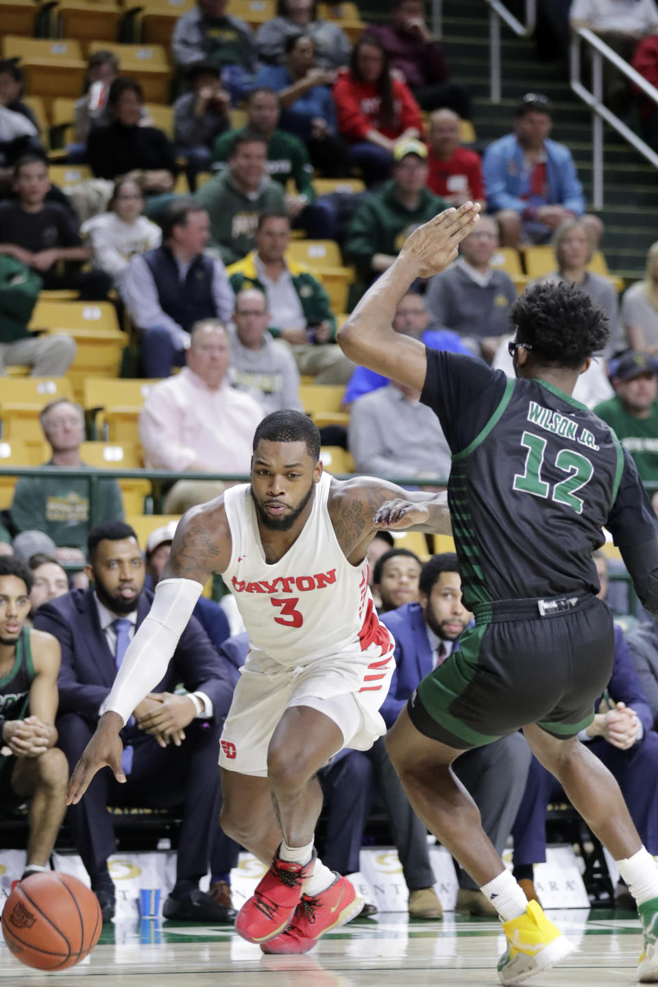 Dayton's Trey Landers (3) moves the ball on George Mason's AJ Wilson (12) during the first half of an NCAA college basketball game, Tuesday, Feb. 25, 2020, in Fairfax, Va. (AP Photo/Luis M. Alvarez)