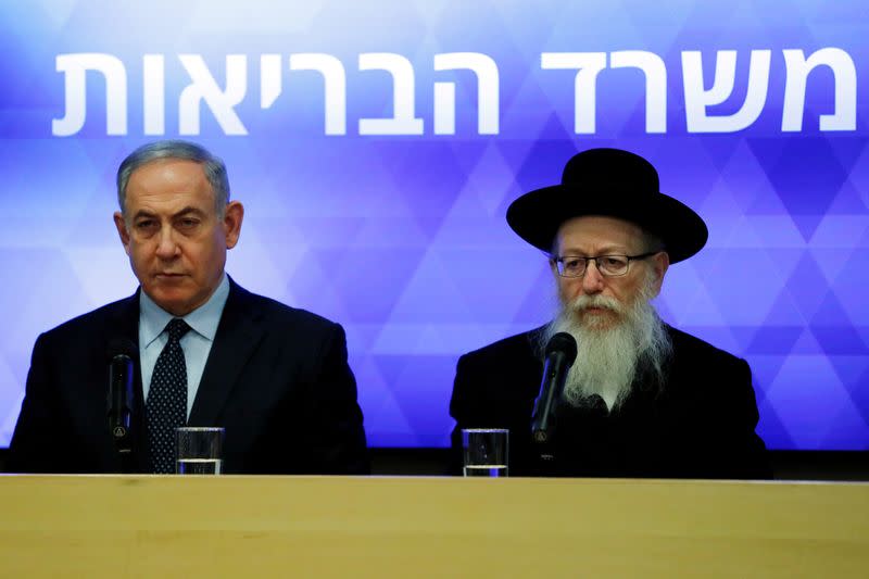 FILE PHOTO: Israeli Prime Minister Benjamin Netanyahu gives a statement together with Health Minister Yaakov Litzman, at the Health Ministry in Jerusalem