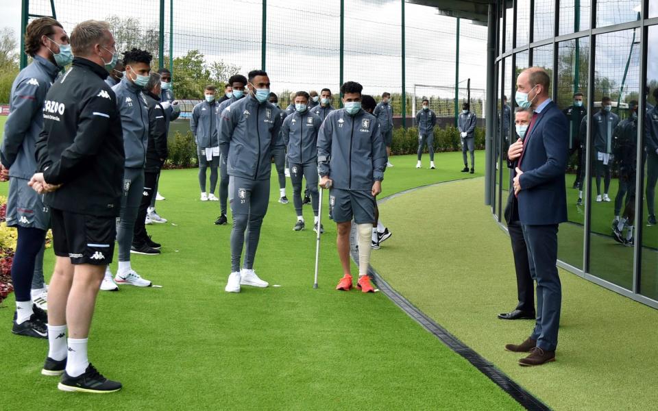 The Duke of Cambridge, right, meets Aston Villa players during a visit to the club's High Performance Centre at Bodymoor Heath Training Centre in Warwickshire - AP