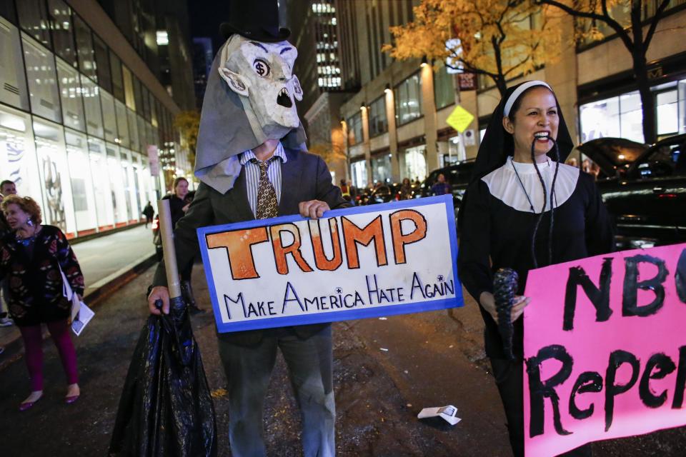 People protest in  front of NBC studios while they are calling for the network to rescind the invitation to Donald Trump to host Saturday Night Live show on November 4, 2015 in New York. 