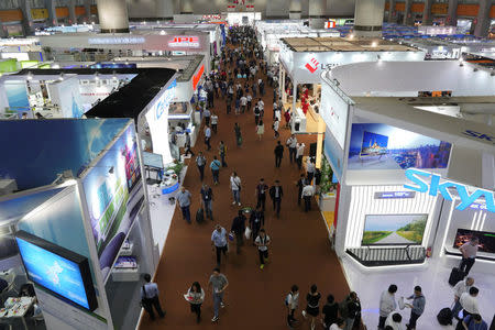 Visitors walk inside one of the exhibition halls for the China Import and Export Fair in Guangzhou, China April 17, 2017. REUTERS/Venus Wu