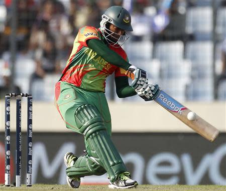 Bangladesh's Shakib Al Hasan plays a ball against Australia during their ICC Twenty20 World Cup match at the Sher-e-Bangla National Cricket Stadium in Dhaka April 1, 2014. REUTERS/Andrew Biraj