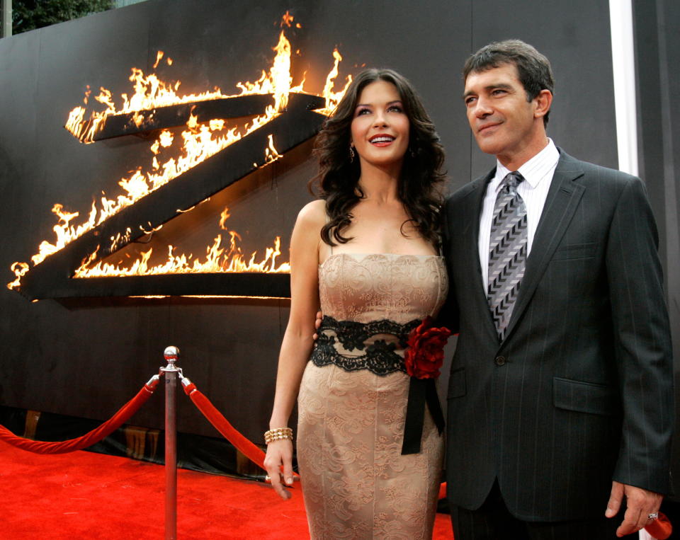 Actress Catherine Zeta-Jones and co-star Antonio Banderas arrive at the Los Angeles premiere of Columbia Pictures' "The Legend of Zorro" at the Orpheum theatre in Los Angeles October 16, 2005.[The movie tells the story of Don Alejandro de la Vega, Zorro (Antonio Banderas), and his wife Elena (Zeta-Jones) as they deal with a threat to California becoming the 31st state of the Union.] The movie opens in the U.S. on October 28.