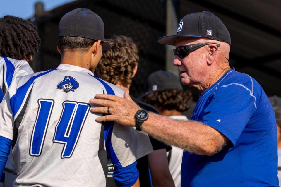 South Dade Head Coach Fred Burnside speaks to players during a high school baseball regional semi-final game against West Broward High at Bobcat Field in Pembroke Pines, Florida, on Wednesday, May 10, 2023.