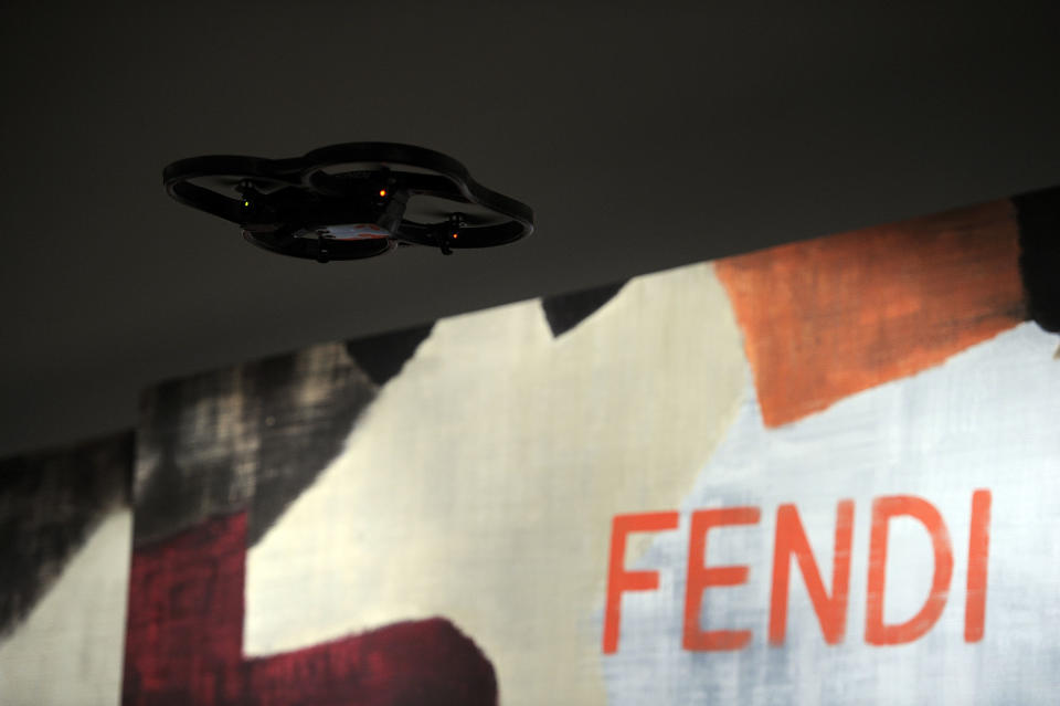 A drone camera flies overhead during Fendi women's Fall-Winter 2014-15 collection, part of the Milan Fashion Week, unveiled in Milan, Italy, Thursday, Feb.20, 2014. (AP Photo/Giuseppe Aresu)