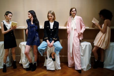 Models display the Spring/Summer 2020 women's ready-to-wear collection as they attend a presentation for fashion house Patou during Paris Fashion Week in Paris