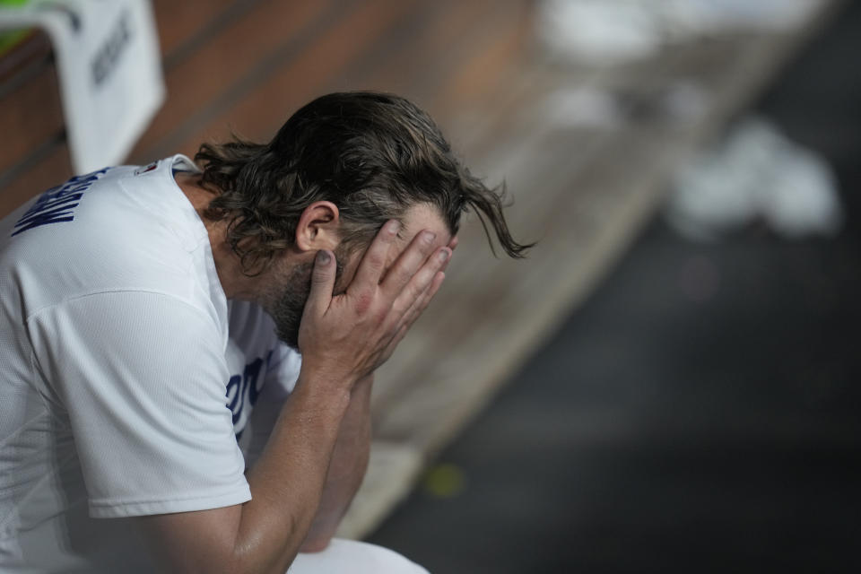 Los Angeles Dodgers starting pitcher Clayton Kershaw reacts after exiting during the first inning in Game 1 of a baseball NL Division Series against the Arizona Diamondbacks, Saturday, Oct. 7, 2023, in Los Angeles. (AP Photo/Ashley Landis)