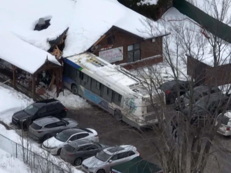 Two children were killed when a city bus was driven into the front of a Laval daycare centre Wednesday, Feb. 8, 2023.  (Steve Rompré/Radio-Canada - image credit)