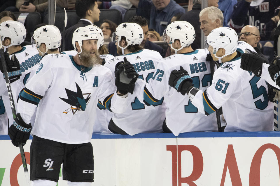 San Jose Sharks center Joe Thornton, left, celebrates after scoring a goal against the New York Rangers during the second period of an NHL hockey game, Saturday, Feb. 22, 2020, at Madison Square Garden in New York. (AP Photo/Mary Altaffer)