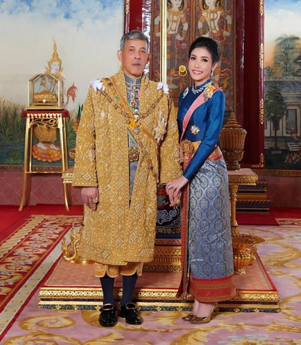 This undated photo posted Monday, Aug. 26, 2019, on the Thailand Royal Office website shows King Maha Vajiralongkorn, left, with Major General Sineenatra Wongvajirabhakdi, the royal noble consort. She was bestowed the title of Chao Khun Phra Sineenatra Bilasakalayani by King Maha Vajiralongkorn during a ceremony in late July. In May the king named another woman Suthida Vajiralongkorn Na Ayudhya as the queen of Thailand. (Thailand Royal Office via AP)