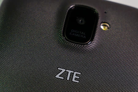 FILE PHOTO: A ZTE smart phone is pictured in this illustration taken April 17, 2018. REUTERS/Carlo Allegri/Illustration/File Photo