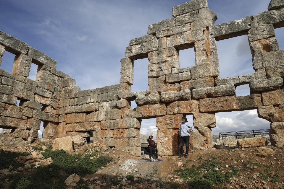 People visit the Church of Saint Simeon 30 kilometers (19 miles) northwest of Aleppo, Syra, Wednesday, March 8, 2023. The Byzantine-era church suffered destruction during the war and was further damaged in the February 2023 earthquake, which hit Turkey and Syria. (AP Photo/Omar Albam)