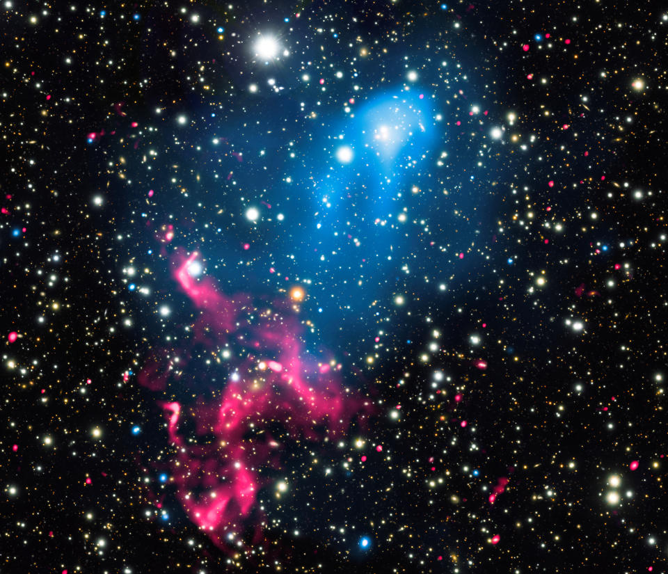 <p>A composite image released by NASA on Jan. 5, 2017 contains X-rays from Chandra (blue), radio emission from the GMRT (red), and optical data from Subaru (red, green, and blue) of the colliding galaxy clusters called Abell 3411 and Abell 3412. (Photo: NASA/Chandra X-ray Observatory/Handout via Reuters) </p>