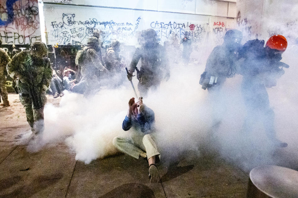 Federal officers use chemical irritants and crowd control munitions to disperse Black Lives Matter protesters outside the Mark O. Hatfield United States Courthouse on  July 22, 2020, in Portland, Ore. (Noah Berger/AP)