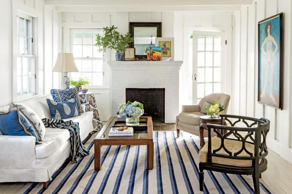 River House living room with white walls and blue accents