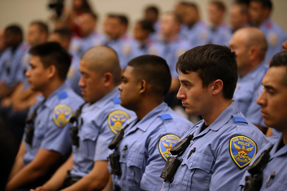 San Francisco police recruits look on during a news conference at the San Francisco Police Academy on May 15, 2018.