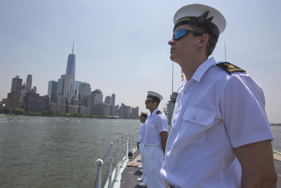 <p>Crew members of Her Majesty Canadian Ship Athabaskan man the rails as they sail past the Lower Manhattan, Wednesday, May 25, 2016 in New York. The annual Fleet Week is bringing a flotilla of activities that includes a parade of ships sailing up the Hudson River and docking around the city. The events continue through Memorial Day. (AP Photo/Mary Altaffer) </p>